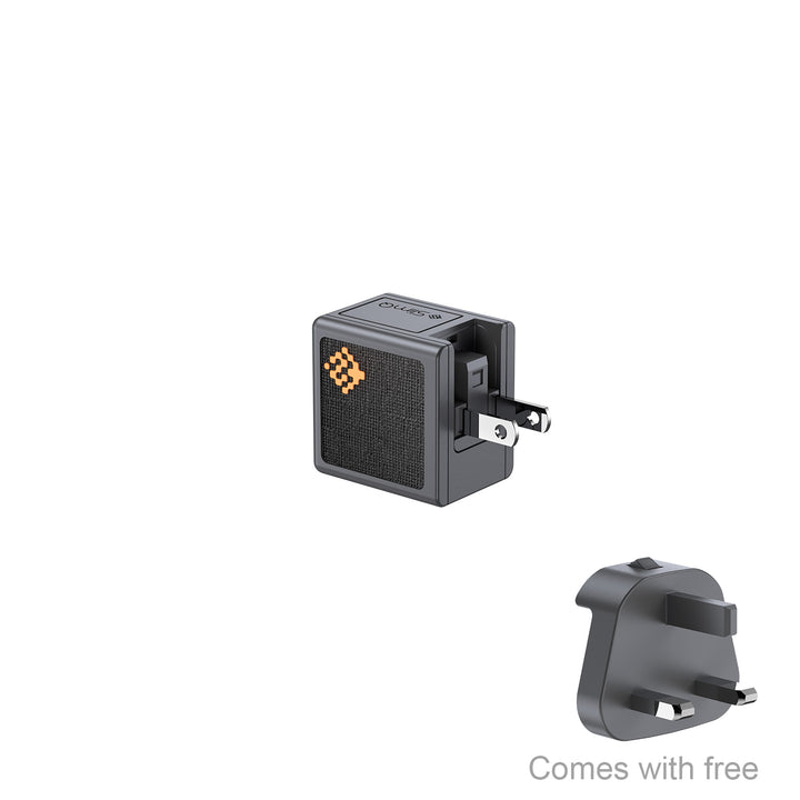 Black electronic device with a small stand on a white background