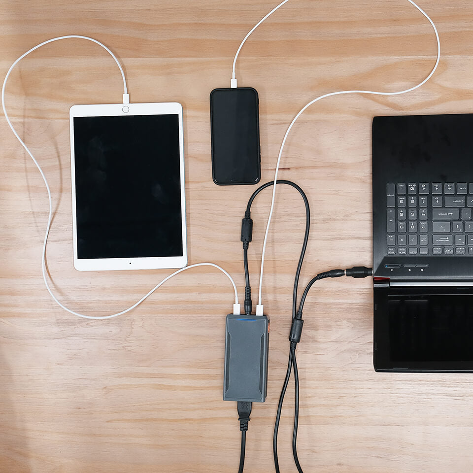 SlimQ GaN charger in lifestyle setting — ideal for travel and work